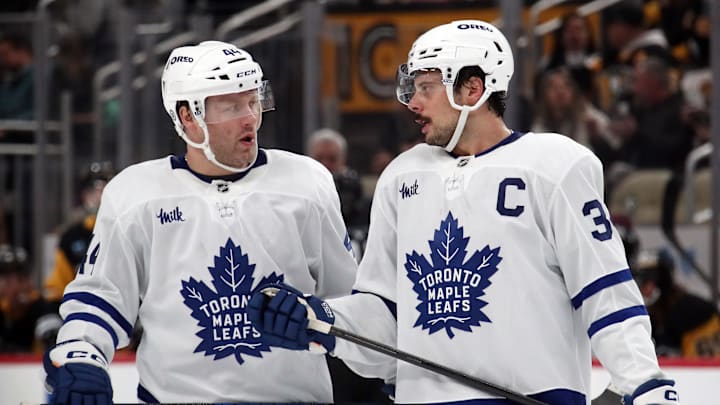 Dec 7, 2024; Pittsburgh, Pennsylvania, USA; Toronto Maple Leafs defenseman Morgan Rielly (44) and center Auston Matthews (34) talk before a face-off against the Pittsburgh Penguins during the second period at PPG Paints Arena. Mandatory Credit: Charles LeClaire-Imagn Images Dec 7, 2024; Pittsburgh, Pennsylvania, USA; Toronto Maple Leafs defenseman Morgan Rielly (44) and center Auston Matthews (34) talk before a face-off against the Pittsburgh Penguins during the second period at PPG Paints Arena. Mandatory Credit: Charles LeClaire-Imagn Images