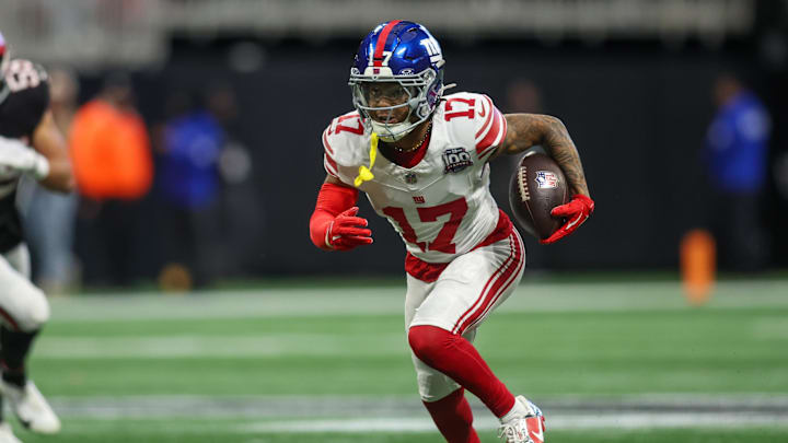Dec 22, 2024; Atlanta, Georgia, USA; New York Giants wide receiver Wan'Dale Robinson (17) runs after a catch against the Atlanta Falcons in the first quarter at Mercedes-Benz Stadium.  