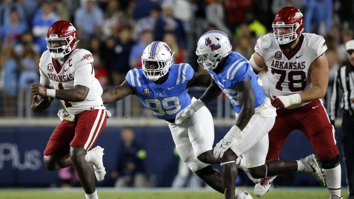 Oct 7, 2023; Oxford, Mississippi, USA; Arkansas Razorbacks quarterback KJ Jefferson (1) runs the ball as Mississippi Rebels defensive linemen Isaac Ukwu (99) pursues during the second half at Vaught-Hemingway Stadium. Mandatory Credit: Petre Thomas-USA TODAY Sports