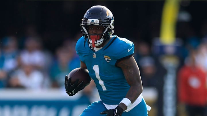 Jacksonville Jaguars running back Travis Etienne Jr. (1) rushes for yards during the third quarter of an NFL football AFC Wild Card playoff matchup, Sunday, Jan. 11, 2026, in Jacksonville, Fla. The Bills defeated the Jaguars 27-24. [Corey Perrine/Florida Times-Union]