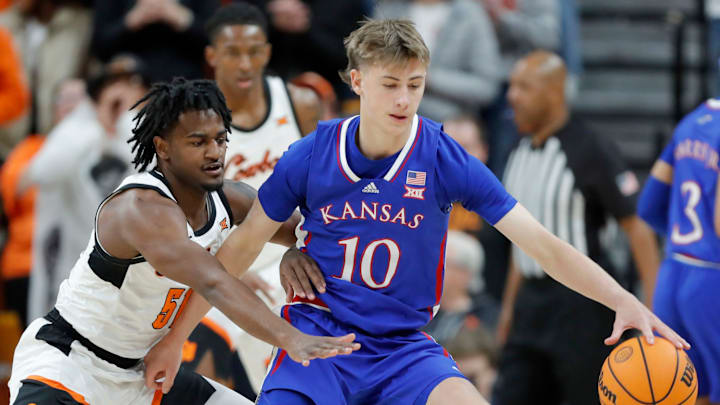Oklahoma State Cowboys guard John-Michael Wright (51) defends Kansas Jayhawks guard Johnny Furphy