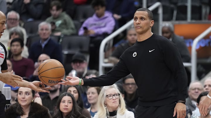 Jan 15, 2025; Toronto, Ontario, CAN; Boston Celtics head coach Joe Mazzulla hands the ball back to an official during the second half against the Toronto Raptors at Scotiabank Arena. Mandatory Credit: John E. Sokolowski-Imagn Images