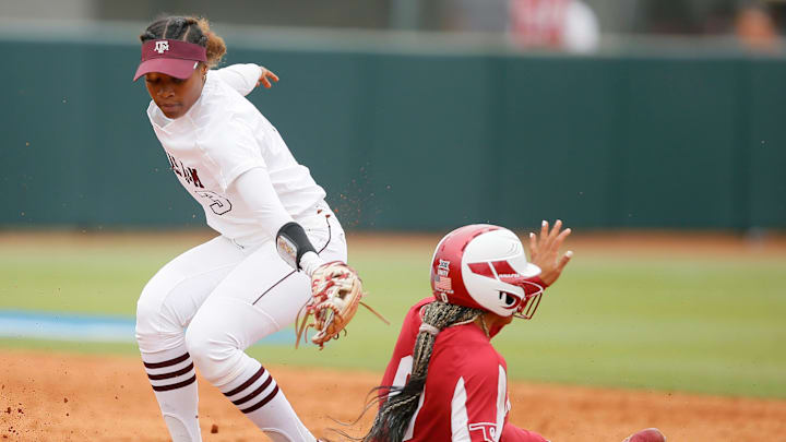 Oklahoma's Rylie Boone (0) slides to second past the ball and Texas A&M's Koko Wooley (3) in the second inning of a softball game between the University of Oklahoma Sooners (OU) and Texas A&M in the NCAA Norman Regional at Marita Hynes Field in Norman, Okla., Saturday, May 21, 2022. Oklahoma won 3-2.

Ncaa Norman Regional