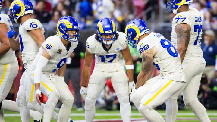 Nov 26, 2023; Glendale, Arizona, USA; Los Angeles Rams tight end Tyler Higbee (89) celebrates a touchdown with wide receiver Puka Nacua (17) and quarterback Matthew Stafford (9) against the Arizona Cardinals in the first half at State Farm Stadium. Mandatory Credit: Mark J. Rebilas-USA TODAY Sports