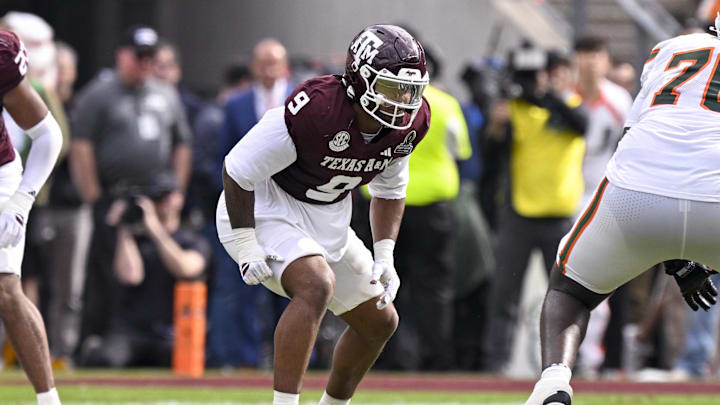 Dec 20, 2025; College Station, TX, USA; Texas A&M Aggies defensive end Cashius Howell (9) lines up during the game between the Aggies and the Hurricanes at Kyle Field. Mandatory Credit: Jerome Miron-Imagn Images