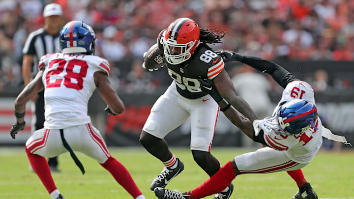 Cleveland Browns tight end Jordan Akins (88) stiff arms New York Giants linebacker Isaiah Simmons (19) is he works across the field during the second half of an NFL football game at Huntington Bank Field, Sunday, Sept. 22, 2024, in Cleveland, Ohio. Cleveland Browns tight end Jordan Akins (88) stiff arms New York Giants linebacker Isaiah Simmons (19) is he works across the field during the second half of an NFL football game at Huntington Bank Field, Sunday, Sept. 22, 2024, in Cleveland, Ohio.