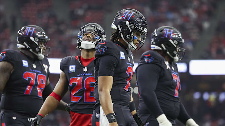 Dec 25, 2024; Houston, Texas, USA;  Houston Texans quarterback C.J. Stroud (7) reacts after a play during the game against the Baltimore Ravens at NRG Stadium. Mandatory Credit: Troy Taormina-Imagn Images