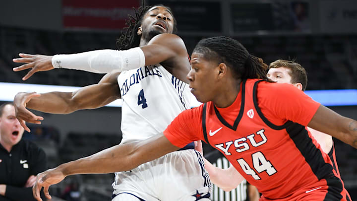 Mar 11, 2025; Indianapolis, IN, USA; Youngstown State Penguins guard Nico Galette (44) knocks the ball away from Robert Morris Colonials guard Josh Omojafo (4) during the first half at Corteva Coliseum. Mandatory Credit: Robert Goddin-Imagn Images Mar 11, 2025; Indianapolis, IN, USA; Youngstown State Penguins guard Nico Galette (44) knocks the ball away from Robert Morris Colonials guard Josh Omojafo (4) during the first half at Corteva Coliseum. Mandatory Credit: Robert Goddin-Imagn Images