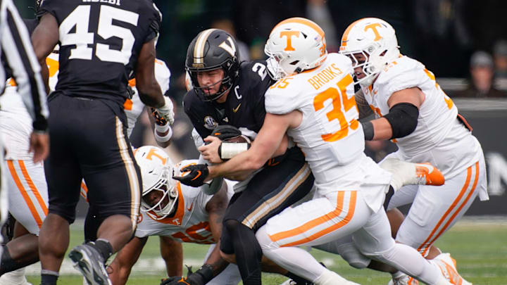 Tennessee defensive back Will Brooks (35) stops Vanderbilt quarterback Diego Pavia (2) during the second quarter at FirstBank Stadium in Nashville, Tenn., Saturday, Nov. 30, 2024.