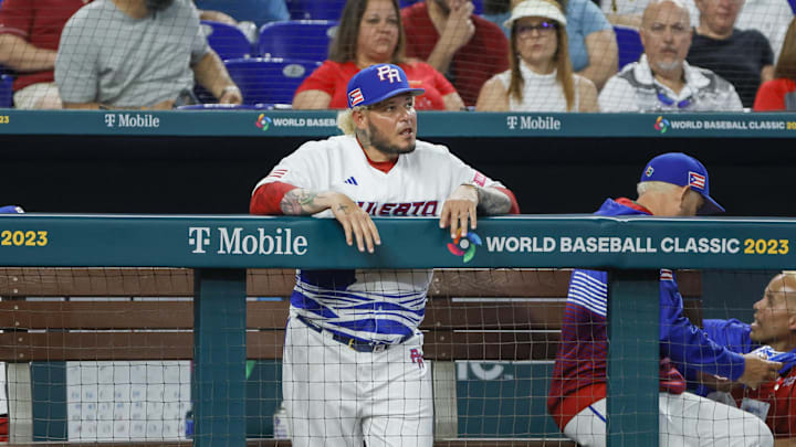 Puerto Rico manager Yadier Molina looks on from the dugout during the sixth inning against Nicaragua at LoanDepot Park in 2023.