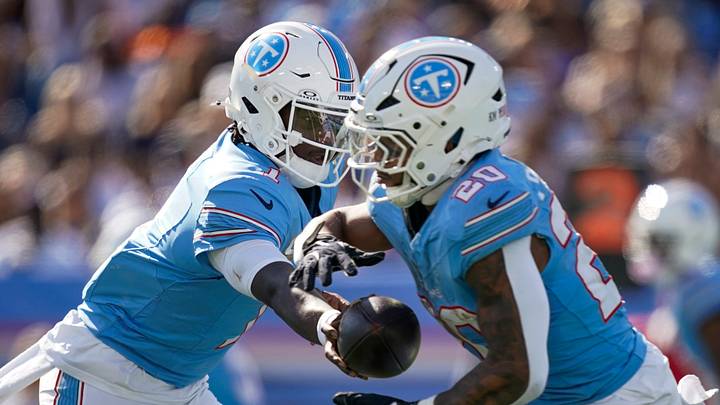 Tennessee Titans quarterback Cam Ward (1) hands off to running back Tony Pollard (20) during the third quarter against the Cleveland Browns at Nissan Stadium in Nashville, Tenn., Sunday, Oct. 25, 2026. Tennessee Titans quarterback Cam Ward (1) hands off to running back Tony Pollard (20) during the third quarter against the Cleveland Browns at Nissan Stadium in Nashville, Tenn., Sunday, Oct. 25, 2026.