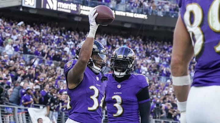 Baltimore Ravens running back Keaton Mitchell (34) celebrates his touchdown against the Seattle Seahawks with wide receiver Odell Beckham Jr. (3) during the third quarter at M&T Bank Stadium. 