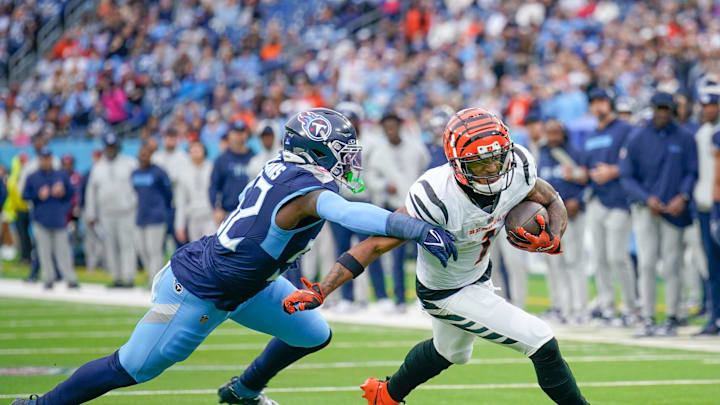 Cincinnati Bengals wide receiver Ja'Marr Chase catches a pass over Tennessee Titans linebacker James Williams.