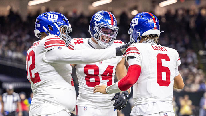 Oct 5, 2025; New Orleans, Louisiana, USA;  New York Giants tight end Theo Johnson (84) and quarterback Jaxson Dart (6) react to a touchdown against New Orleans Saints during the first half at Caesars Superdome.  