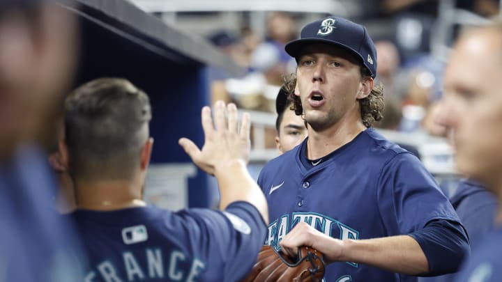 Seattle Mariners starting pitcher Logan Gilbert (36) celebrates in the dugout against the Miami Marlins in the seventh inning at loanDepot Park on June 22. Seattle Mariners starting pitcher Logan Gilbert (36) celebrates in the dugout against the Miami Marlins in the seventh inning at loanDepot Park on June 22.
