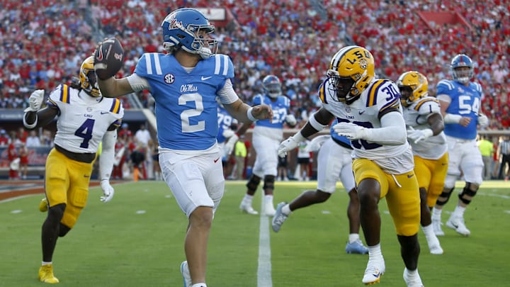 Sep 30, 2023; Oxford, Mississippi, USA; Mississippi Rebels quarterback Jaxson Dart (2) passes the ball as LSU Tigers linebacker Greg Penn III (30) pursues during the first half at Vaught-Hemingway Stadium. Mandatory Credit: Petre Thomas-Imagn Images Sep 30, 2023; Oxford, Mississippi, USA; Mississippi Rebels quarterback Jaxson Dart (2) passes the ball as LSU Tigers linebacker Greg Penn III (30) pursues during the first half at Vaught-Hemingway Stadium. Mandatory Credit: Petre Thomas-Imagn Images