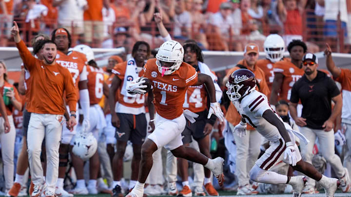 Sep 28, 2024; Austin, Texas, USA; Texas Longhorns wide receiver Johntay Cook II (1) runs from Mississippi State Bulldogs safety Corey Ellington (10) in the second half at Darrell K Royal-Texas Memorial Stadium. Mandatory Credit: Daniel Dunn-Imagn Images Sep 28, 2024; Austin, Texas, USA; Texas Longhorns wide receiver Johntay Cook II (1) runs from Mississippi State Bulldogs safety Corey Ellington (10) in the second half at Darrell K Royal-Texas Memorial Stadium. Mandatory Credit: Daniel Dunn-Imagn Images
