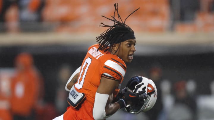 Oct 28, 2023; Stillwater, Oklahoma, USA; Oklahoma State Cowboys running back Ollie Gordon II (0) warms up before a game against the Cincinnati Bearcats at Boone Pickens Stadium. Mandatory Credit: Bryan Terry-USA TODAY Sports Oct 28, 2023; Stillwater, Oklahoma, USA; Oklahoma State Cowboys running back Ollie Gordon II (0) warms up before a game against the Cincinnati Bearcats at Boone Pickens Stadium. Mandatory Credit: Bryan Terry-USA TODAY Sports