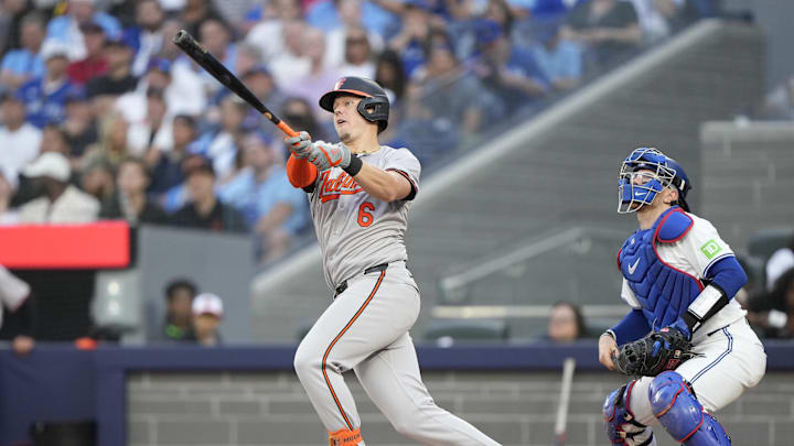 Jun 4, 2024; Toronto, Ontario, CAN; Baltimore Orioles first baseman Ryan Mountcastle (6) hits a three-run home run against the Toronto Blue Jays during the third inning at Rogers Centre. Mandatory Credit: John E. Sokolowski-USA TODAY Sports