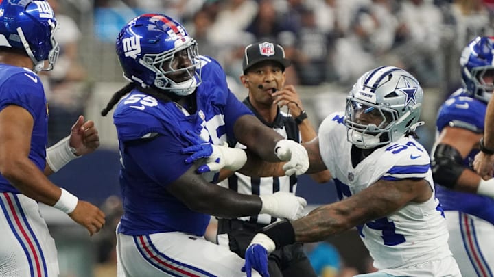 Sep 14, 2025; Arlington, Texas, USA; New York Giants offensive tackle James Hudson III (55) is called for a unnecessary roughness after a play against Dallas Cowboys defensive end Sam Williams (54) during the first quarter at AT&T Stadium.  