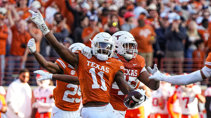 Texas Longhorns edge rusher Colin Simmons (11) celebrates an interception during the game against Clemson in the first round of the College Football Playoffs at Darrell K Royal-Texas Memorial Stadium on Saturday, Dec. 21, 2024.