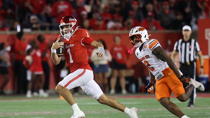 Oct 17, 2026; Houston, Texas, USA; Houston Cougars quarterback Conner Weigman (1) runs with the ball past Oklahoma State Cowboys linebacker Isaiah Chisom (2) during the third quarter at TDECU Stadium. Mandatory Credit: Troy Taormina-Imagn Images Oct 17, 2026; Houston, Texas, USA; Houston Cougars quarterback Conner Weigman (1) runs with the ball past Oklahoma State Cowboys linebacker Isaiah Chisom (2) during the third quarter at TDECU Stadium. Mandatory Credit: Troy Taormina-Imagn Images