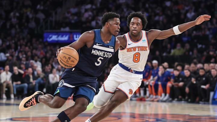 Jan 1, 2024; New York, New York, USA;  Minnesota Timberwolves guard Anthony Edwards (5) looks to drive past New York Knicks forward OG Anunoby (8) in the first quarter at Madison Square Garden. Mandatory Credit: Wendell Cruz-Imagn Images