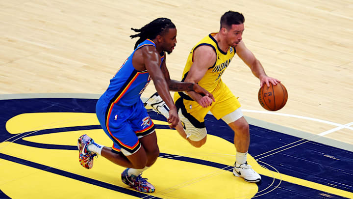 Jun 11, 2025; Indianapolis, Indiana, USA; Indiana Pacers guard T.J. McConnell (9) drives to the basket against Oklahoma City Thunder guard Cason Wallace (22) during the second quarter in game three of the 2025 NBA Finals at Gainbridge Fieldhouse. Mandatory Credit: Trevor Ruszkowski-Imagn Images