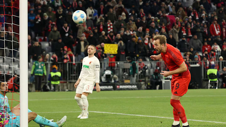 Harry Kane heads home his third of the night and 50th goal in the Bundesliga