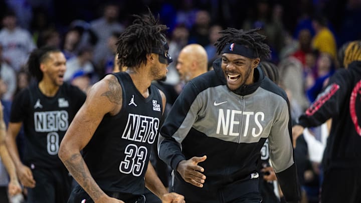 Feb 22, 2025; Philadelphia, Pennsylvania, USA; Brooklyn Nets center Nic Claxton (33) celebrates with center Day'Ron Sharpe after scoring the game winning shot against the Philadelphia 76ers as time expired in the fourth quarter at Wells Fargo Center. Mandatory Credit: Bill Streicher-Imagn Images