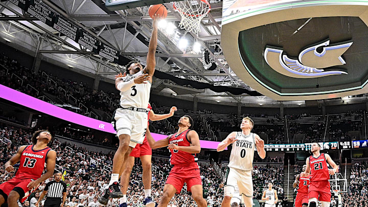 Nov 19, 2024; East Lansing, Michigan, USA; Michigan State Spartans guard Jaden Akins (3) shoots the ball against the Samford Bulldogs during the second half at Jack Breslin Student Events Center. Mandatory Credit: Dale Young-Imagn Images Nov 19, 2024; East Lansing, Michigan, USA; Michigan State Spartans guard Jaden Akins (3) shoots the ball against the Samford Bulldogs during the second half at Jack Breslin Student Events Center. Mandatory Credit: Dale Young-Imagn Images