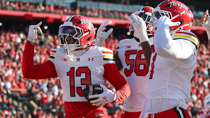Nov 8, 2025; Piscataway, New Jersey, USA; Maryland Terrapins defensive back Lavain Scruggs (13) celebrates after an interception during the first half against the Rutgers Scarlet Knights at SHI Stadium. Mandatory Credit: Vincent Carchietta-Imagn Images