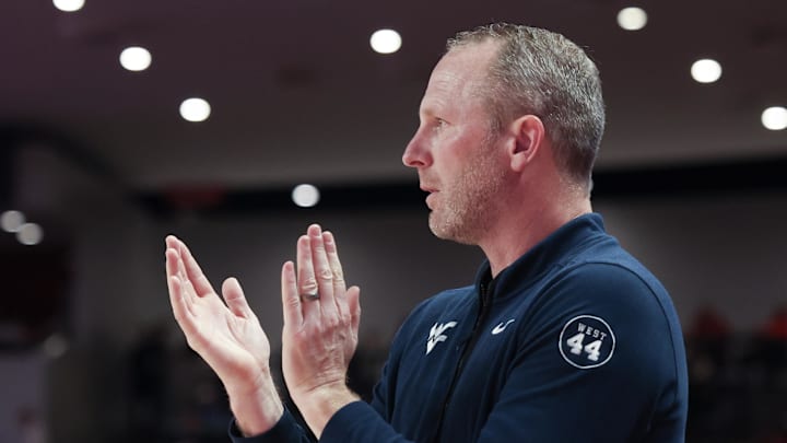 Jan 15, 2025; Houston, Texas, USA;  West Virginia Mountaineers head coach Darian DeVries coaches against the Houston Cougars in the first half at Fertitta Center. Mandatory Credit: Thomas Shea-Imagn Images