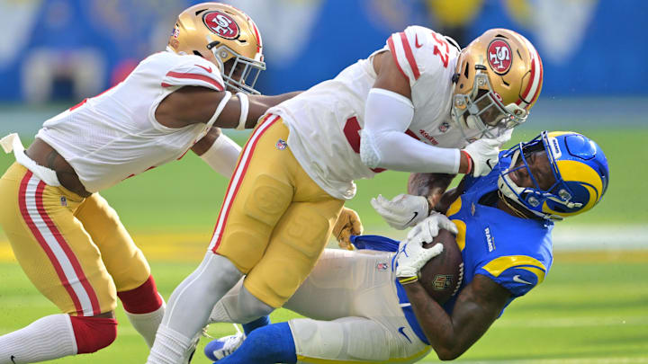 Jan 9, 2022; Inglewood, California, USA;  San Francisco 49ers outside linebacker Dre Greenlaw (57) was called for unnecessary roughness after a hit on Los Angeles Rams wide receiver Van Jefferson (12) in the first half of the game at SoFi Stadium. Mandatory Credit: Jayne Kamin-Oncea-Imagn Images