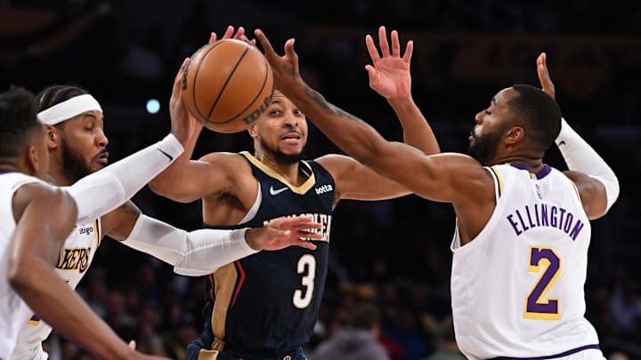 Feb 27, 2022; Los Angeles, California, USA; Los Angeles Lakers forward Carmelo Anthony (7) and guard Wayne Ellington (2) defend a pass by New Orleans Pelicans guard CJ McCollum (3) in the second half at Crypto.com Arena. Mandatory Credit: Jayne Kamin-Oncea-Imagn Images Feb 27, 2022; Los Angeles, California, USA; Los Angeles Lakers forward Carmelo Anthony (7) and guard Wayne Ellington (2) defend a pass by New Orleans Pelicans guard CJ McCollum (3) in the second half at Crypto.com Arena. Mandatory Credit: Jayne Kamin-Oncea-Imagn Images