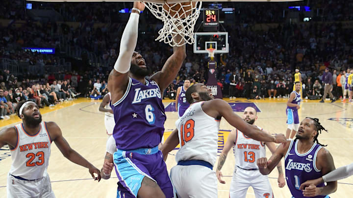 Feb 5, 2022; Los Angeles, California, USA;   Los Angeles Lakers forward LeBron James (6) gets by New York Knicks center Mitchell Robinson (23) for a dunk in the second half at Crypto.com Arena. Mandatory Credit: Jayne Kamin-Oncea-Imagn Images