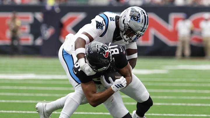 Aug 16, 2025; Houston, Texas, USA; Houston Texans wide receiver Jayden Higgins (81) is tackled by Carolina Panthers cornerback Mike Jackson (2) in the first quarter at NRG Stadium. Mandatory Credit: Thomas Shea-Imagn Images