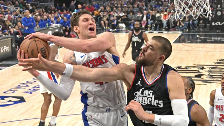 Feb 10, 2024; Los Angeles, California, USA; Detroit Pistons center Mike Muscala (41) reaches in front of Los Angeles Clippers center Ivica Zubac (40) for a rebound in the first half at Crypto.com Arena. Mandatory Credit: Jayne Kamin-Oncea-USA TODAY Sports Feb 10, 2024; Los Angeles, California, USA; Detroit Pistons center Mike Muscala (41) reaches in front of Los Angeles Clippers center Ivica Zubac (40) for a rebound in the first half at Crypto.com Arena. Mandatory Credit: Jayne Kamin-Oncea-USA TODAY Sports