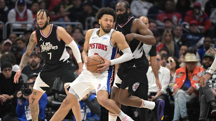 Feb 10, 2024; Los Angeles, California, USA;  Detroit Pistons guard Cade Cunningham (2) is defended by Los Angeles Clippers guard James Harden (1) in the second half at Crypto.com Arena. Mandatory Credit: Jayne Kamin-Oncea-Imagn Images