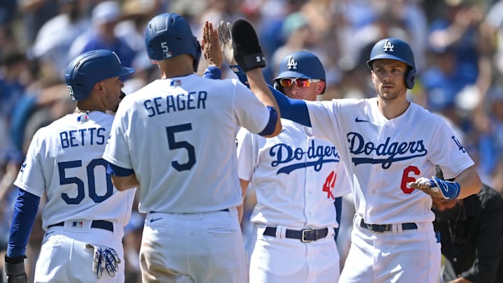 Oct 3, 2021; Los Angeles, California, USA;  Los Angeles Dodgers right fielder Mookie Betts (50),  shortstop Corey Seager (5) and first baseman Matt Beaty (45) score on a grand slam home run by shortstop Trea Turner (6) in the fifth inning of the game against the Milwaukee Brewers at Dodger Stadium. Mandatory Credit: Jayne Kamin-Oncea-USA TODAY Sports