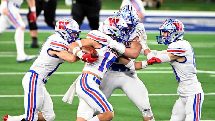 Westlake   s Michael Taaffe (14) celebrates with his teammates after his interception in the second half during the  UIL Class 6A Division 1 state championship football game between Southlake Carroll and Westlake, Saturday, Jan. 16, 2021, in Arlington, Texas. Westlake won 52-34.

Ms1 4102