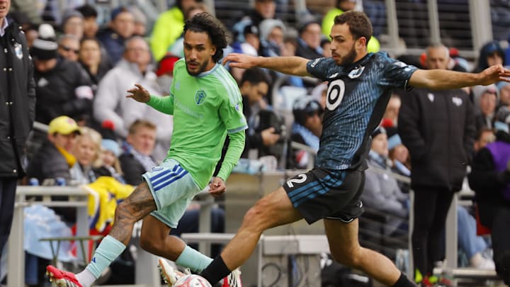 Mar 22, 2026; Saint Paul, Minnesota, USA; Minnesota United FC defender Devin Padelford (2) defends against Seattle Sounders FC forward Jesús Ferreira (9) in the second half at Allianz Field. Mandatory Credit: Bruce Kluckhohn-Imagn Images