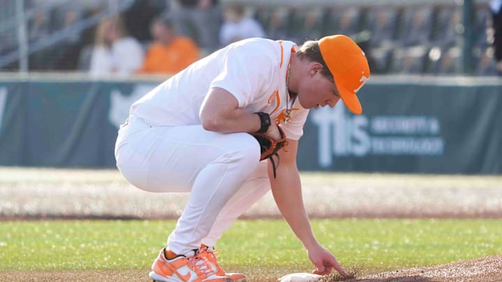 Tennessee pitcher Liam Doyle (12) marks in the dirt at the Tennessee baseball season opener against Hofstra, in Lindsey Nelson Stadium at University of Tennessee in Knoxville, Tenn., Friday, February. 14, 2025. Tennessee pitcher Liam Doyle (12) marks in the dirt at the Tennessee baseball season opener against Hofstra, in Lindsey Nelson Stadium at University of Tennessee in Knoxville, Tenn., Friday, February. 14, 2025.