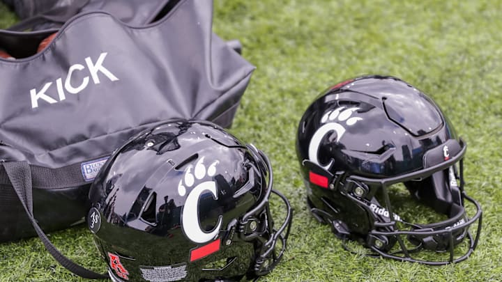 Oct 30, 2021; New Orleans, Louisiana, USA;  Cincinnati Bearcats helmets on the ground during the game against Tulane Green Wave during the second half at Yulman Stadium. Mandatory Credit: Stephen Lew-Imagn Images