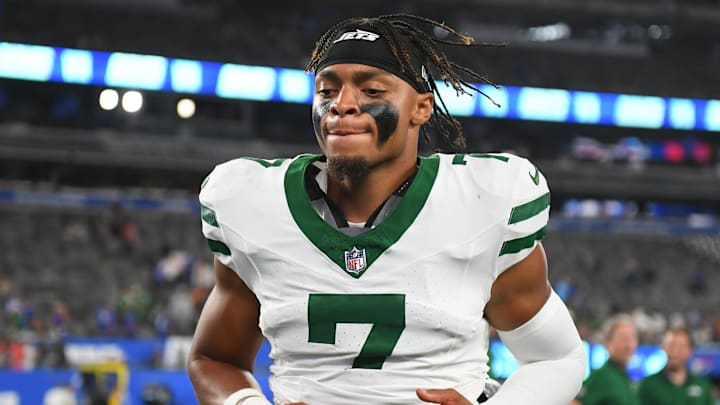 Aug 16, 2025; East Rutherford, New Jersey, USA; New York Jets quarterback Justin Fields (7) jogs off the field following a game against the New York Giants at MetLife Stadium. 