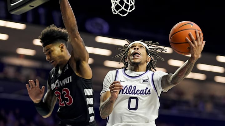 Dec 30, 2024; Manhattan, Kansas, USA; Kansas State Wildcats guard Dug McDaniel (0) shoots against Cincinnati Bearcats forward Dillon Mitchell (23) during the second half at Bramlage Coliseum. Mandatory Credit: Jay Biggerstaff-Imagn Images Dec 30, 2024; Manhattan, Kansas, USA; Kansas State Wildcats guard Dug McDaniel (0) shoots against Cincinnati Bearcats forward Dillon Mitchell (23) during the second half at Bramlage Coliseum. Mandatory Credit: Jay Biggerstaff-Imagn Images