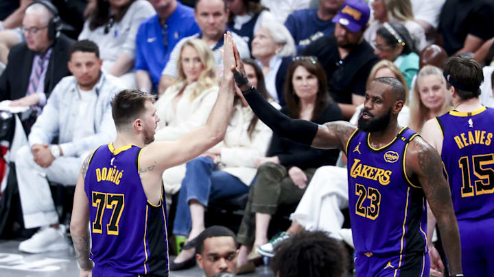 Apr 9, 2025; Dallas, Texas, USA;  Los Angeles Lakers guard Luka Doncic (77) celebrates with Los Angeles Lakers forward LeBron James (23) during the fourth quarter against the Dallas Mavericks at American Airlines Center. Mandatory Credit: Kevin Jairaj-Imagn Images