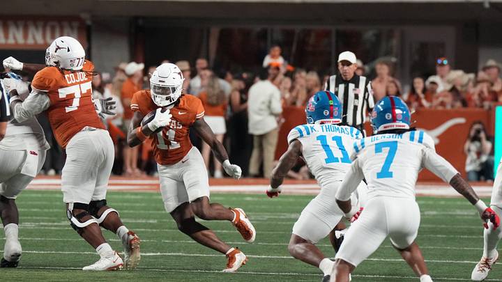 Oct 24, 2026; Austin, Texas, USA;  Texas Longhorns running back Michael Terry III (11) carries the ball as Mississippi Rebels linebacker Keaton Thomas (11) and safety Sharif Denson (7) pursue at Darrell K Royal-Texas Memorial Stadium.  Mandatory Credit: Scott Wachter-Imagn Images