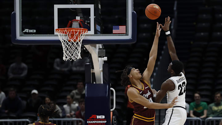 Mar 15, 2025; Washington, D.C., USA; VCU Rams guard Joe Bamisile (22) shoots the ball as Loyola Chicago Ramblers center Miles Rubin (24) defends in the first half in a semifinal of the Atlantic 10 Conference Tournament at Capital One Arena. Mandatory Credit: Geoff Burke-Imagn Images Mar 15, 2025; Washington, D.C., USA; VCU Rams guard Joe Bamisile (22) shoots the ball as Loyola Chicago Ramblers center Miles Rubin (24) defends in the first half in a semifinal of the Atlantic 10 Conference Tournament at Capital One Arena. Mandatory Credit: Geoff Burke-Imagn Images