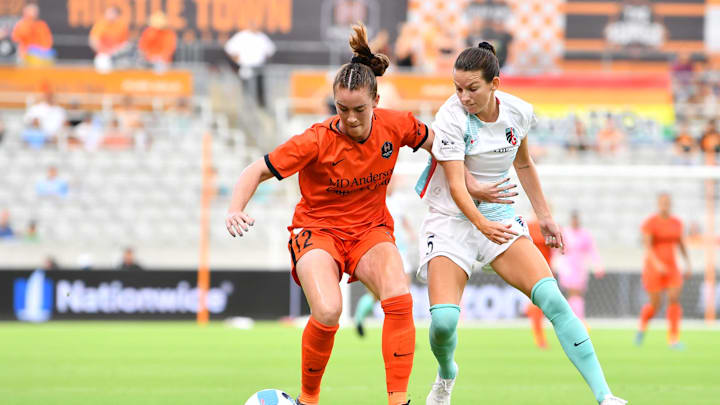 Jul 1, 2022; Houston, Texas, USA;  Houston Dash defender Julia Ashley (12) and Kansas City Current
